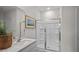 Modern bathroom featuring a walk-in shower with glass doors, a sleek vanity, and stylish fixtures at 24 Saddle Mare St, Clayton, NC 27520