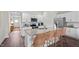 Modern kitchen featuring stainless steel appliances, granite countertops, and stylish island seating at 24 Saddle Mare St, Clayton, NC 27520