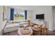 Comfortable living room with a plush sofa, stylish decor, and a large window with natural light at 24 Saddle Mare St, Clayton, NC 27520