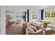 Bright and airy open-concept living space featuring a comfortable sofa and stylish decor at 24 Saddle Mare St, Clayton, NC 27520