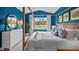 Stylish main bedroom with a wooden bed frame, soft linens, and natural light from the window at 24 Saddle Mare St, Clayton, NC 27520