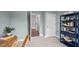 Bright office space with neutral walls, a decorative desk, shelving, and an adjacent doorway at 24 Saddle Mare St, Clayton, NC 27520