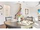 Dining area with hardwood floors and seating for four at 2409 Heathcote Ln, Apex, NC 27502