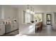 Bright kitchen with a large island, stylish pendant lighting, and modern appliances at 2656 Welham Aly, Raleigh, NC 27608