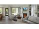 Cozy living room with fireplace, built-in shelving, and neutral-toned furniture at 2656 Welham Aly, Raleigh, NC 27608