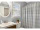Bathroom featuring a shower, window, and new toilet at 2820 Bedfordshire Ct, Raleigh, NC 27604