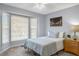 Bedroom with bay window, carpeted floors, and a picture hanging on the wall at 2820 Bedfordshire Ct, Raleigh, NC 27604