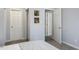 Bedroom with two doors and light gray walls at 2820 Bedfordshire Ct, Raleigh, NC 27604