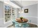 Cozy dining area with natural light, modern light fixture, and seating for four at 2820 Bedfordshire Ct, Raleigh, NC 27604
