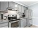 Well-equipped kitchen with stainless steel appliances and granite countertops at 2820 Bedfordshire Ct, Raleigh, NC 27604