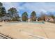 Large community pool with ample deck space and mature trees, perfect for relaxation and recreation at 2820 Bedfordshire Ct, Raleigh, NC 27604