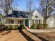 Charming single-story home with a welcoming front porch and mature landscaping on a sunny day at 308 Trimble Ave, Cary, NC 27511