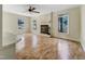 Living room with windows, a fireplace, hardwood floors, and a ceiling fan at 308 Trimble Ave, Cary, NC 27511