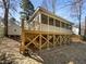 Back porch with stairs and a screened-in space, with a backyard at 308 Trimble Ave, Cary, NC 27511