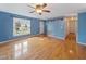 The living room is painted blue and has hard wood floors at 319 Forest Ln, Wendell, NC 27591