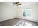 Cozy bedroom featuring neutral carpeting, a ceiling fan, and a window providing natural light at 4120 Standing Rock Way, Raleigh, NC 27604