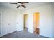Bedroom with neutral carpet and two adjoining walk in closets with an ensuite bathroom at 4120 Standing Rock Way, Raleigh, NC 27604
