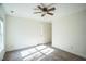 Simple bedroom with neutral carpet, ceiling fan, and ample space; ready for personalization at 4120 Standing Rock Way, Raleigh, NC 27604
