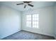 Cozy bedroom with neutral carpet and a large window at 4120 Standing Rock Way, Raleigh, NC 27604