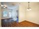 Bright dining room showcasing hardwood floors, fresh paint, modern ceiling fan, and lots of natural light at 4120 Standing Rock Way, Raleigh, NC 27604