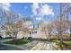 Well-maintained two-story townhome with front porch, tidy landscaping, and a driveway, near a cul-de-sac at 4120 Standing Rock Way, Raleigh, NC 27604