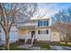 Charming two-story townhome with a covered front porch and neutral siding, offering a welcoming curb appeal at 4120 Standing Rock Way, Raleigh, NC 27604