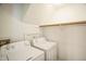 Bright laundry room offers a washer, dryer, and storage at 4120 Standing Rock Way, Raleigh, NC 27604