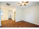 Spacious living area featuring hardwood floors, a ceiling fan, and doorways to other areas of the home at 4120 Standing Rock Way, Raleigh, NC 27604