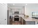 Modern kitchen features granite counters, stainless steel appliances, and ample cabinet space at 426 Belgian Red Way, Wake Forest, NC 27587