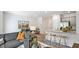 Open concept space with a modern kitchen, a comfortable living area, and bar stool seating at 426 Belgian Red Way, Wake Forest, NC 27587