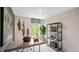 Well-lit home office features a modern desk, decorative artwork, and ample natural light at 426 Belgian Red Way, Wake Forest, NC 27587
