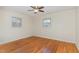 Bright bedroom with hardwood floors and two windows allowing lots of natural light at 4410 David St, Durham, NC 27704