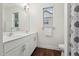 Bright bathroom featuring a double sink vanity, a window offering natural light, and modern fixtures at 475 Long View Dr, Franklinton, NC 27525