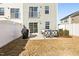 Spacious backyard featuring a patio with outdoor seating and a BBQ grill, perfect for entertaining at 4918 Neuse Commons Ln, Raleigh, NC 27616