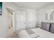 Neutral bedroom with a walk-in closet and an adjacent ensuite bathroom at 4918 Neuse Commons Ln, Raleigh, NC 27616
