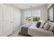 Bright bedroom featuring neutral colors and a large window at 4918 Neuse Commons Ln, Raleigh, NC 27616
