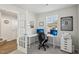 Bright home office with modern desk, dual monitors, and sporty wall decor at 4918 Neuse Commons Ln, Raleigh, NC 27616