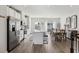 Bright eat-in kitchen features stainless steel appliances, white cabinetry, and large center island with seating at 4918 Neuse Commons Ln, Raleigh, NC 27616