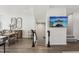 Open concept living room with dining area and modern staircase at 4918 Neuse Commons Ln, Raleigh, NC 27616