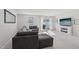 Cozy living room with plush gray sectional, fireplace, and sliding glass doors at 4918 Neuse Commons Ln, Raleigh, NC 27616