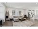 Comfortable living room with updated flooring and stainless steel kitchen appliances at 4918 Neuse Commons Ln, Raleigh, NC 27616