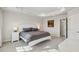 Inviting bedroom with a tray ceiling, two windows, and carpeted floors to create a comfortable space at 4918 Neuse Commons Ln, Raleigh, NC 27616