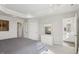 Bright main bedroom with tray ceiling and ensuite bathroom at 4918 Neuse Commons Ln, Raleigh, NC 27616