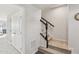 Bright stairway features neutral colors, white trim, and carpeted steps at 4918 Neuse Commons Ln, Raleigh, NC 27616