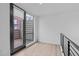 Small balcony with privacy siding and view of neighboring apartment building at 615 W Peace St # 406, Raleigh, NC 27605