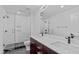 Modern bathroom with glass shower door, white subway tile, and double vanity at 615 W Peace St # 406, Raleigh, NC 27605