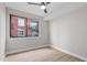 Bedroom with ceiling fan, bright window, and light colored flooring at 615 W Peace St # 406, Raleigh, NC 27605