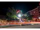 Restaurant building at night, featuring outdoor dining and a lively atmosphere in an urban area at 615 W Peace St # 406, Raleigh, NC 27605