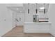 Bright, open-concept kitchen with a breakfast bar and hardwood floors at 615 W Peace St # 406, Raleigh, NC 27605