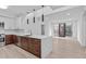 Contemporary kitchen with stainless steel appliances, white countertops, and modern pendant lighting at 615 W Peace St # 406, Raleigh, NC 27605